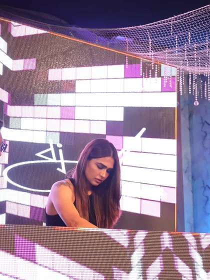 Focused on the mix during a Delhi wedding gig. I pay close attention to the flow of the event, ensuring the music complements every moment perfectly.