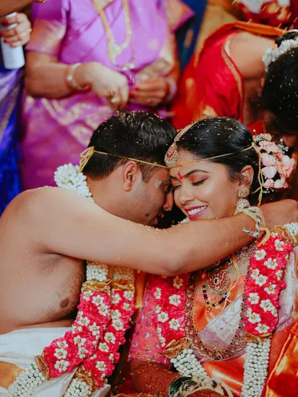 An intimate hug between the bride and groom during their ceremony, a moment of comfort and love.