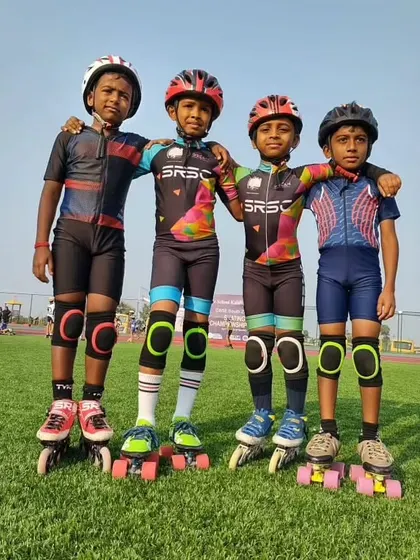 Friends and teammates. Four of our young skaters from the Sharath Roller Skating Club pose together, showcasing the camaraderie we build.