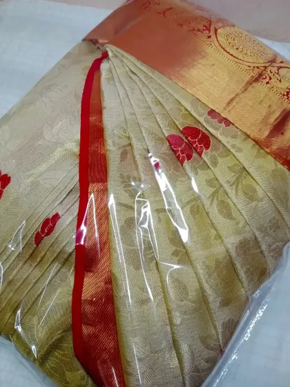 This beautiful brocade saree is pleated and packed, with the pleats customized for the client. It's now ready for her special event.