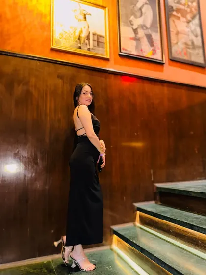 A reminder to love yourself, just the way you are. A classic black backless gown for an elegant evening look.