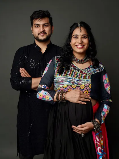 A proud and happy couple in their festive best. This Garba-themed maternity portrait is a beautiful celebration of their love and growing family.