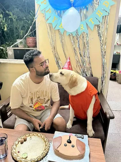 A birthday kiss for the birthday boy. These moments of connection between pets and their parents are what inspire us to create the best treats for your celebrations.
