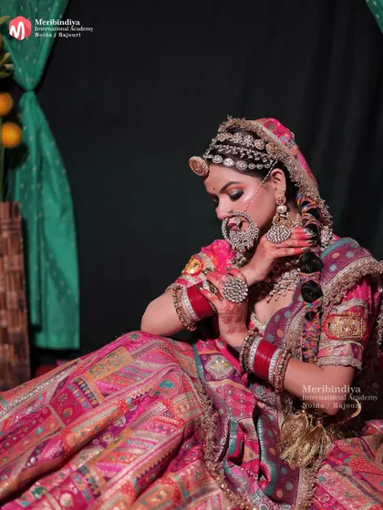 This full-length view shows how the traditional braided hairstyle, adorned with accessories, complements the vibrant Rajasthani attire.