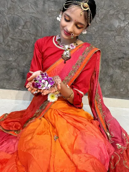My little Radha, glowing with charm. The saree is draped to be comfortable for a child while looking traditional and beautiful.