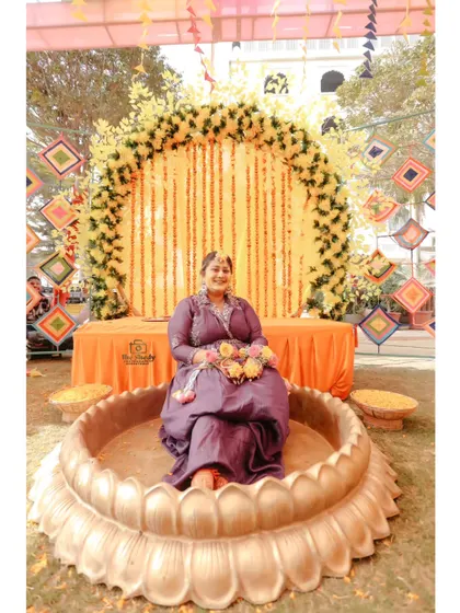 A grand seating arrangement for the bride at her outdoor Haldi ceremony. We capture the scale and beauty of your event's decor.
