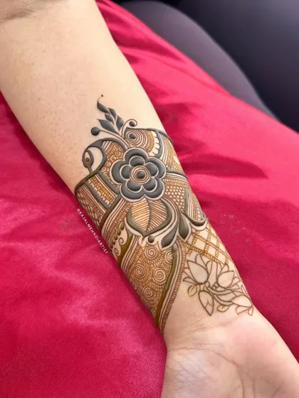 The forearm design for an engagement set, with a beautiful shaded flower and lotus details.