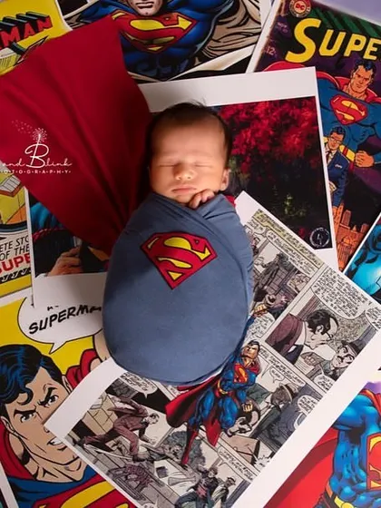 It's a bird, it's a plane, it's Super-baby! This classic Superman theme uses comic book pages as a backdrop for our tiny hero, wrapped in his iconic colors.