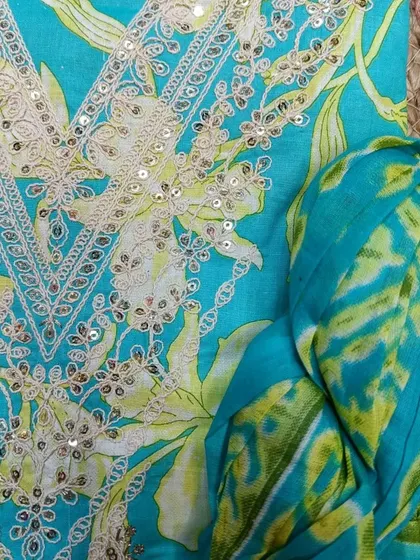 This bright and cheerful turquoise suit piece is another lovely gift idea to make her Mother's Day memorable.