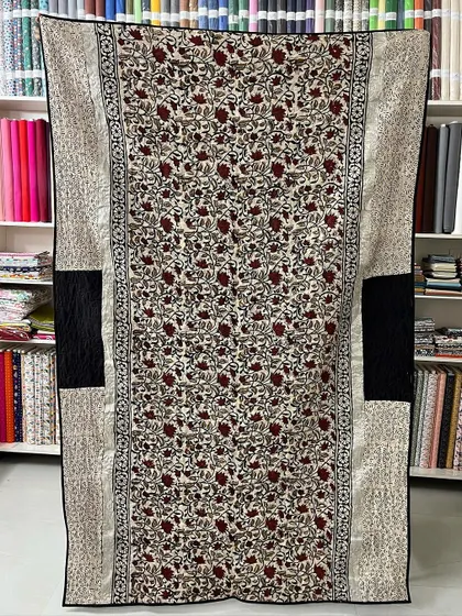 Another view of a saree quilt, showcasing how we use different sections of the fabric to create a balanced and beautiful composition.