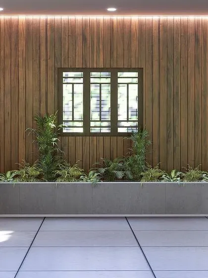 A view of the parking area's feature wall, with wood paneling, a traditional-style window, and an integrated planter box.
