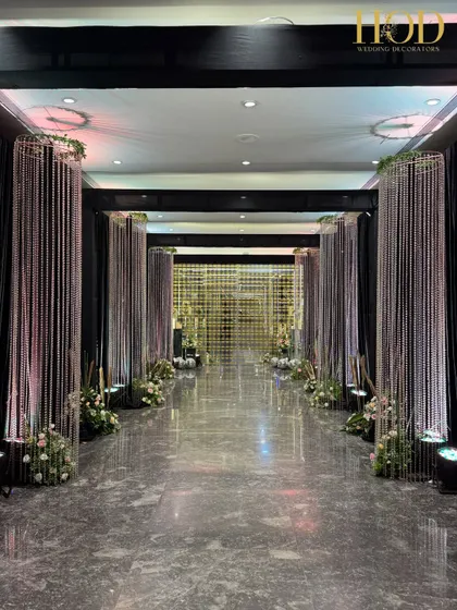 A long shot of the crystal-lined hallway, creating a powerful sense of arrival. The dark drapes behind the crystals make them pop, enhancing the feeling of walking through a path of diamonds.