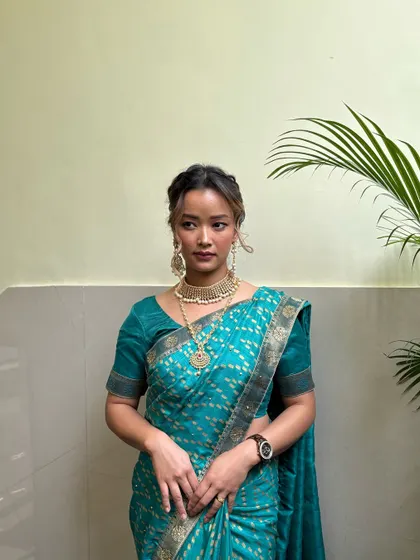 A full-length view of the South Indian bridal look, demonstrating how our students learn to consider the entire aesthetic, from makeup to saree draping.