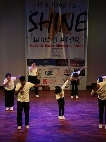 Our younger students performing a group routine on the big stage. We choreograph age-appropriate dances that are fun and help build confidence.
