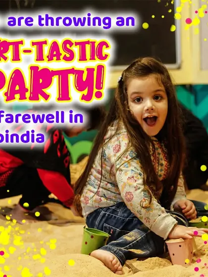 A candid shot of a girl enjoying the sandpit during a party. It's a space for pure, unadulterated fun.