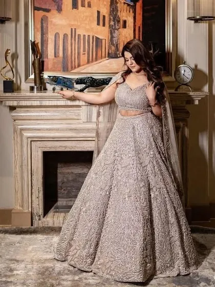 A client looking absolutely radiant in her fully embroidered reception lehenga. I focus on creating a perfect fit to ensure you are comfortable and confident throughout your event.