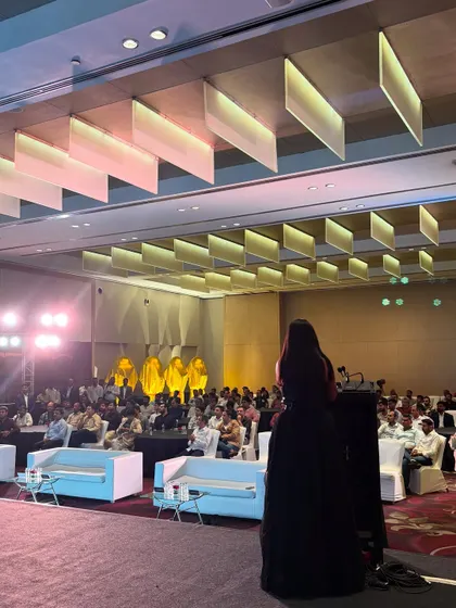 A wide shot of the V-Guard conference. It shows the scale of the corporate events I handle, where I command the stage and hold the attention of a large professional audience.