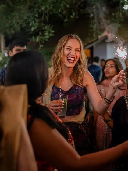 A lively entrance with friends and sparklers. We capture the collective joy and celebration of your Sangeet night, creating images that are full of energy and happiness.