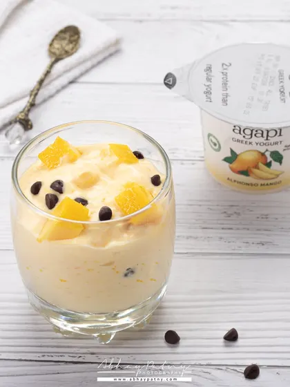 This shot showcases a dessert made with yogurt. The bright, clean styling helps position it as a healthier, guilt-free treat.