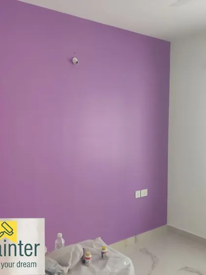 The same lavender accent wall, showing the smooth, even coverage of the paint.