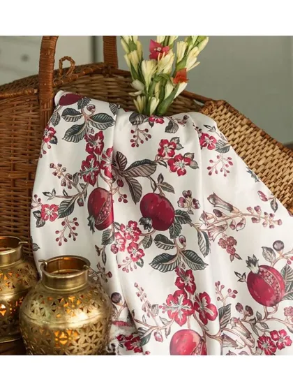 The Glen Snow White fabric from the Forest Story collection features a beautiful pomegranate and floral print. This versatile fabric is perfectly suited for upholstery, bringing a touch of fresh, botanical elegance to furniture.