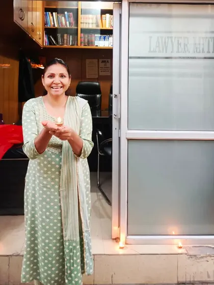 Advocate Ritu Rawat celebrating Diwali at the Lawyer Mitra office, which is a reflection of our team's spirit.