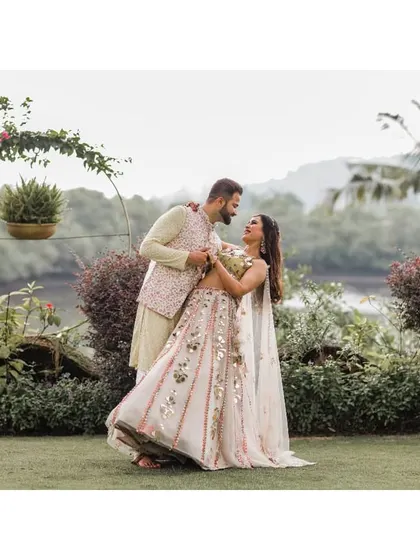 A playful, dancing moment between the couple at their Haldi ceremony in Goa.