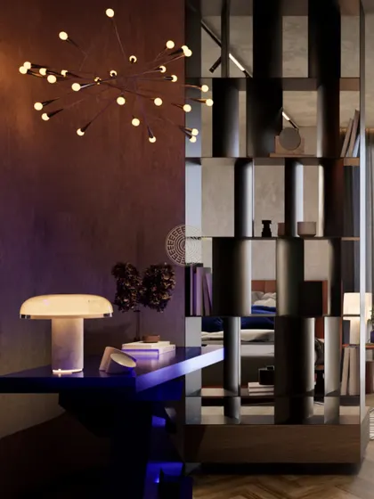 A study or reading corner within the master suite, featuring a bold blue desk and a modern sputnik chandelier. A mirrored shelving unit acts as a room divider, adding depth and reflecting light.