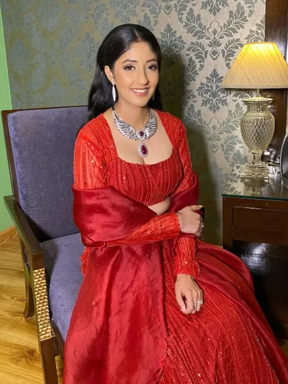 Gorgeous in red for her cocktail look! I created a classic glam look with soft, defined eyes and a radiant complexion to match her elegant sequined outfit.