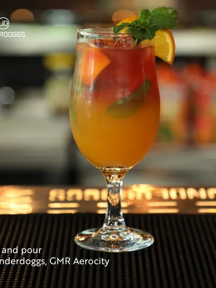 A colourful layered cocktail sits on the bar at Underdoggs. This is a place to 'play and pour', combining fun and games with great drinks for an entertaining evening.