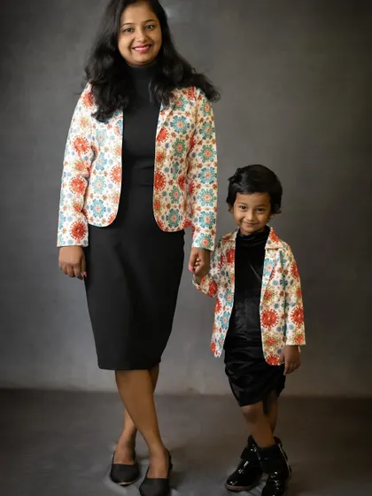 Another shot of our stylish mother-daughter duo. We love capturing the pride and love in their expressions as they pose together.