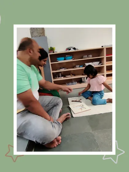 Shrishti works independently on a botany puzzle, demonstrating her focus and self-reliance. Her parents observe her ability to engage deeply with the materials, a key goal of Montessori education.