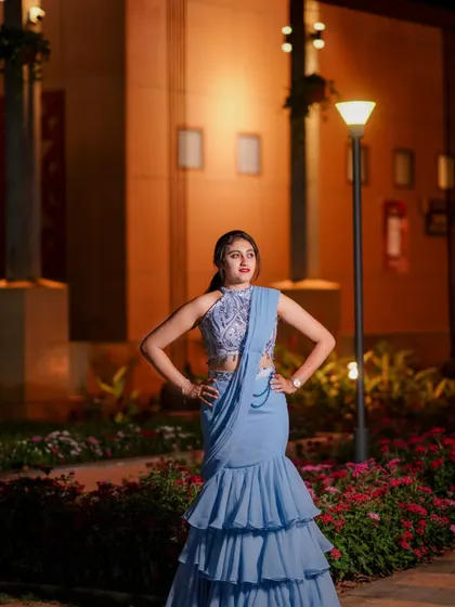 A confident pose in the modern ruffled half saree, perfect for a sangeet or reception.