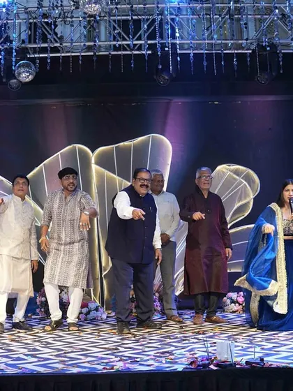 The uncles and fathers showing off their moves. I make sure to involve every generation in the on-stage fun.