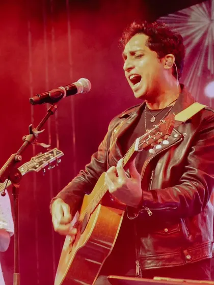 Nikhil D'Souza delivering a powerful vocal performance during his live show in Pune. His indie and Bollywood fusion is a massive hit with college crowds.