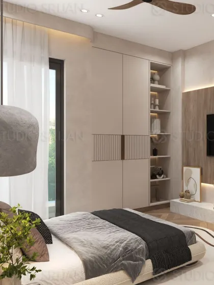 This view shows the wardrobe and storage solution, which includes open shelving for display, seamlessly integrated into the wall.
