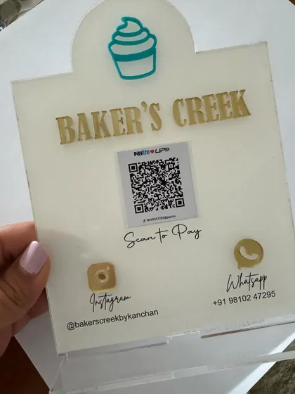 This angled view shows the sturdy acrylic base and the professional finish of the 'Baker's Creek' custom scanner stand.