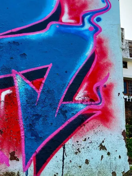 A side view of the Shiva mural, showing how the artwork wraps around the corner of the building.