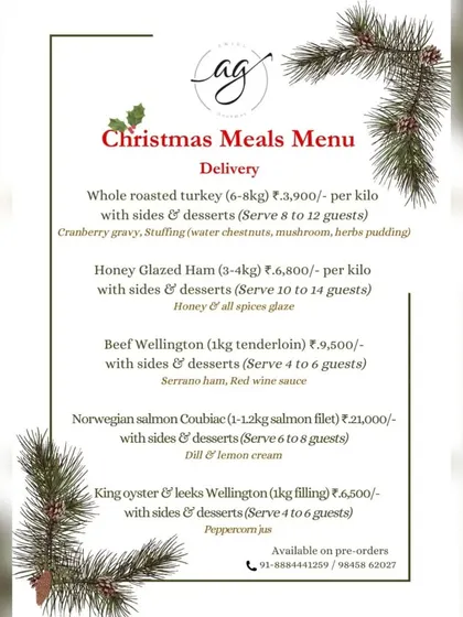 Another version of our Christmas Meals delivery menu, detailing options like Honey Glazed Ham and Norwegian Salmon Coulibiac, designed to serve groups of various sizes.