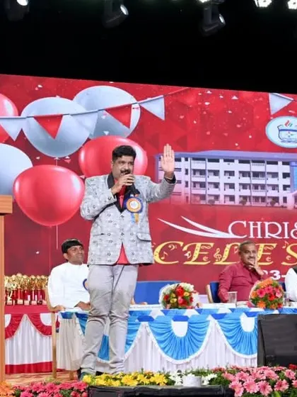 Waving to the audience at the CMI Public School function. I ensure my acts are family-friendly and enjoyable for everyone from children to elders.