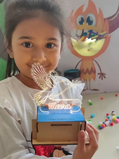 A close-up of a personalized light-up lamp, made by the birthday girl herself. Each child gets to customize their project, making it truly their own.