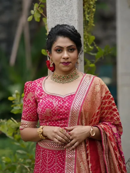 The client looks gorgeous in her custom pink lehenga with a gota patti work blouse.