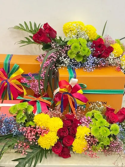 A wedding gift for a couple's 'Final Fiesta' themed brunch. I used a riot of colorful flowers and ribbons to match the fun, vibrant theme, creating a truly joyful and celebratory hamper.