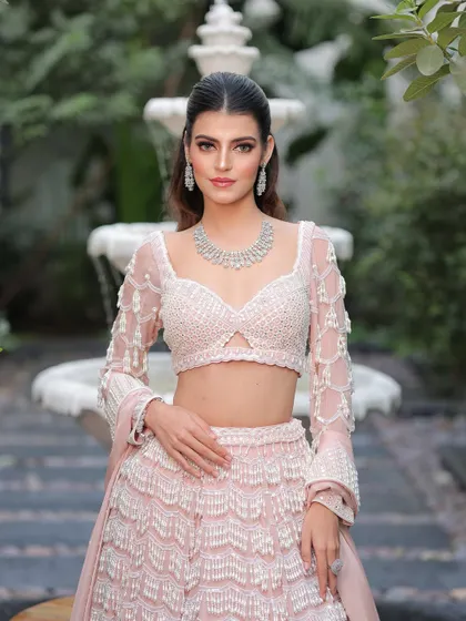 A confident and poised bride. The makeup is fresh and modern, perfect for a daytime wedding or an elegant evening reception.