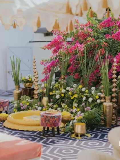 A graceful and personal Haldi ceremony set within the bride's home. The decor combines soft pastels with bright bougainvillea and heritage-inspired details for a thoughtfully grand celebration.