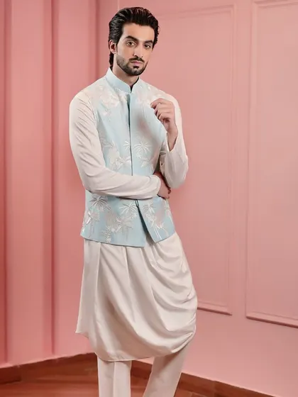 A confident look in our powder blue embroidered Nehru jacket. This piece is a testament to our ability to create contemporary classics that are both versatile and timeless.