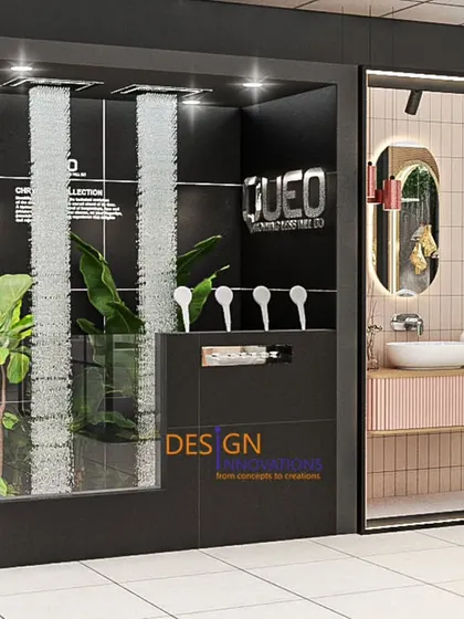 For this QUEO showroom, we designed distinct display pods to showcase different bathroom concepts. This vignette features a minimalist vanity and shower setup next to a dramatic water feature, demonstrating the brand's blend of style and innovation.