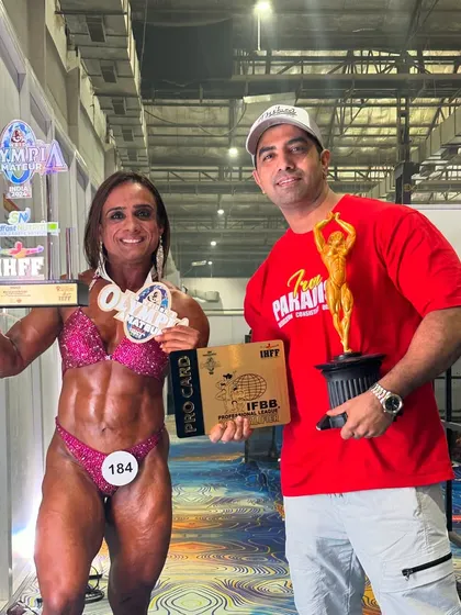 This is what we work for. Here I am with my athlete, Anshul Bhardwaj, right after she won her IFBB Pro Card and the gold medal. Turning dedicated athletes into professional champions is my ultimate goal.