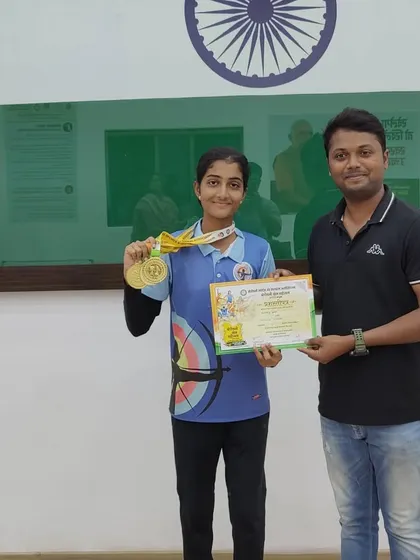 Presenting a certificate and medals to another one of our champions from the Borivali Krida Mahotsava.