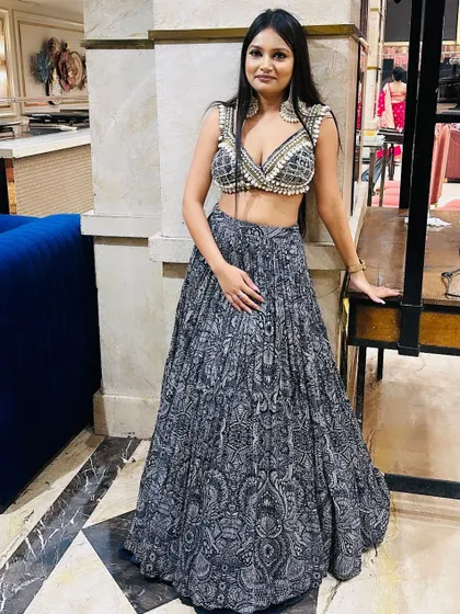 A client looking absolutely stunning in a modern printed lehenga with a pearl-embellished blouse. A perfect look for a cocktail or sangeet.